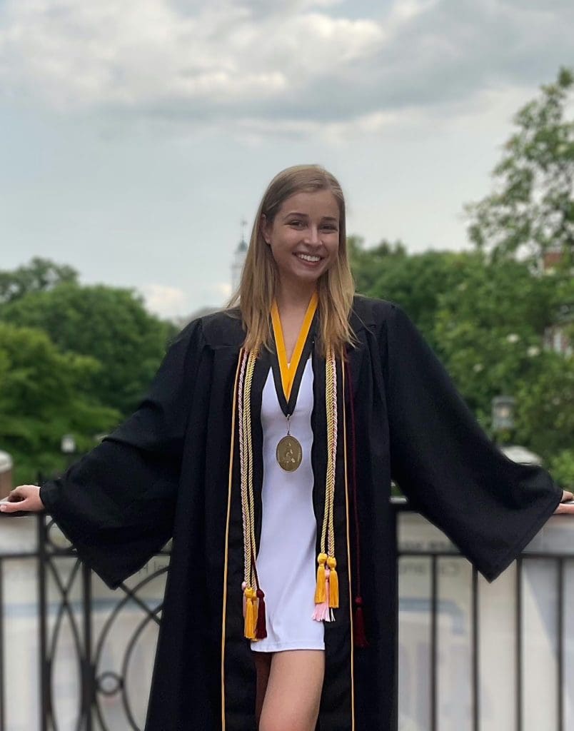 Holly Nelson in JHU cap and gown